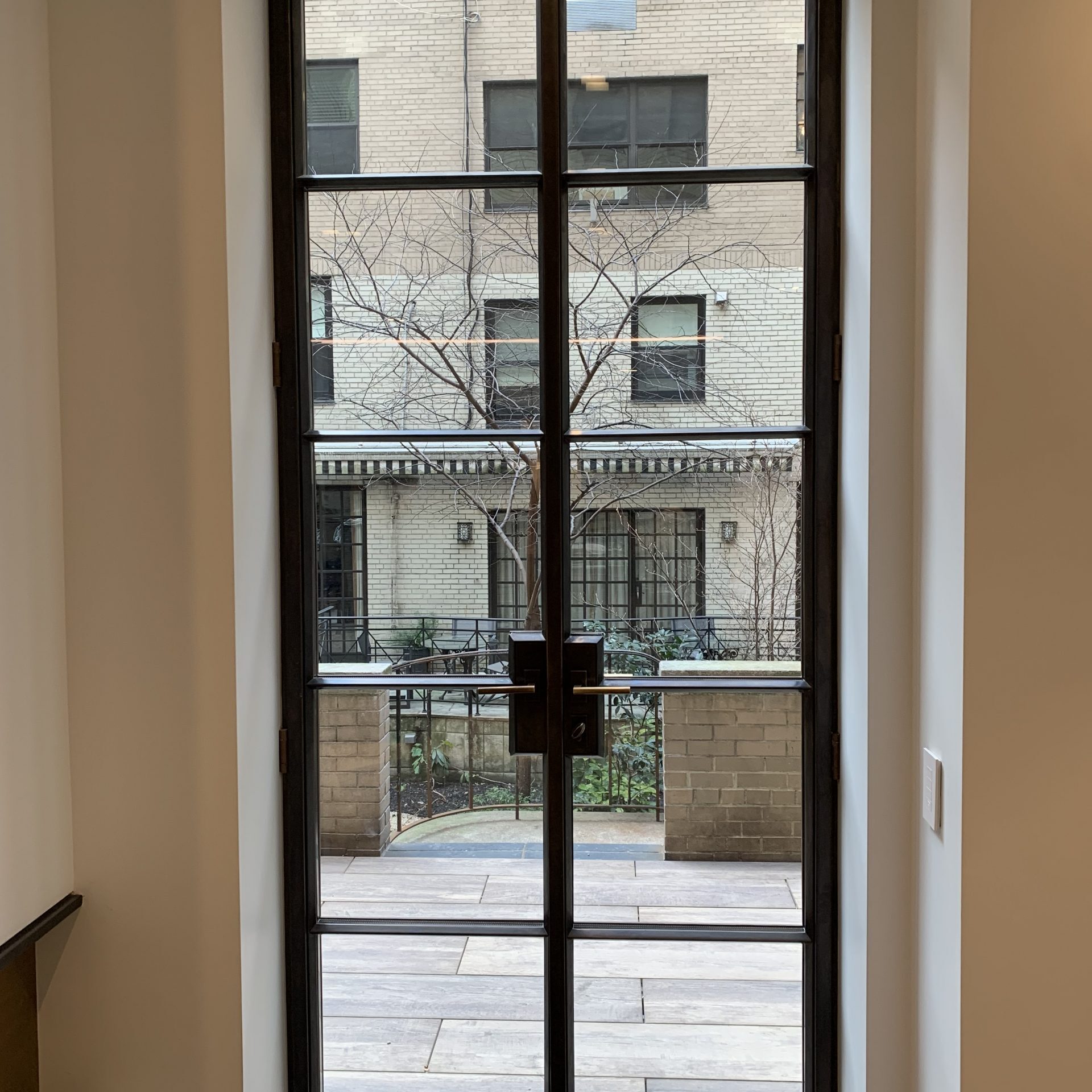Artistic-Bronze-doors-to-back-yard-retreat-in-NYC-scaled-square